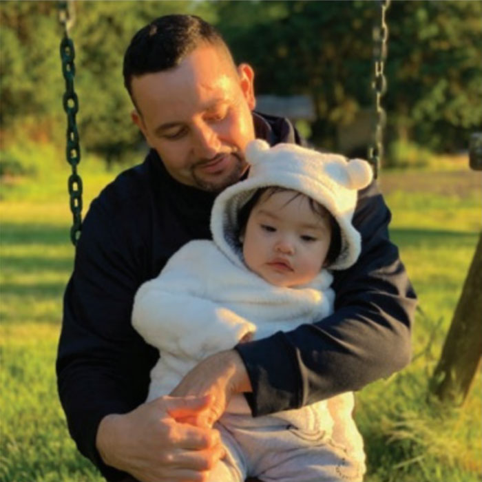 Father and baby on a swing